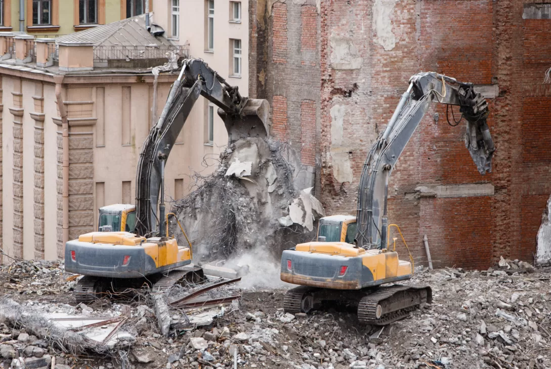 two cranes at the building demolition site by Multidemolition Malaysia