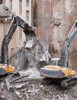 two cranes at the building demolition site by Multidemolition Malaysia