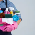 Indonesia maid holding a bunch of essential cleaning tools