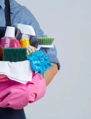 Indonesia maid holding a bunch of essential cleaning tools