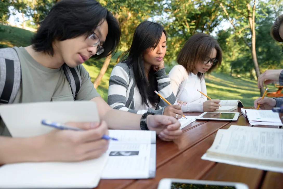 group of concentrated secondary school students studying for A-Levels in Malaysia