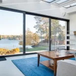 living room with a suspended sliding door showing a view of the outside