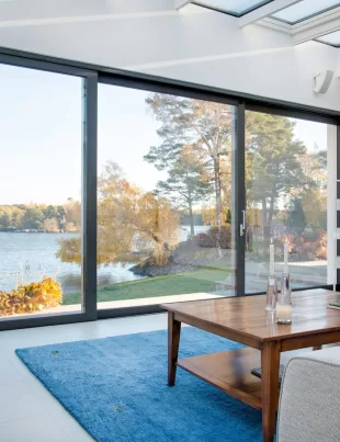 living room with a suspended sliding door showing a view of the outside