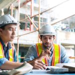 two contractors working in a factory