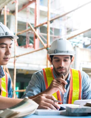 two contractors working in a factory