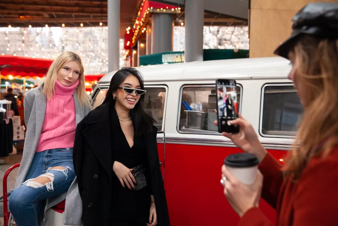 attendees of an event taking pictures with the mobile event truck