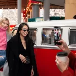 attendees of an event taking pictures with the mobile event truck