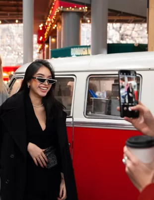 attendees of an event taking pictures with the mobile event truck