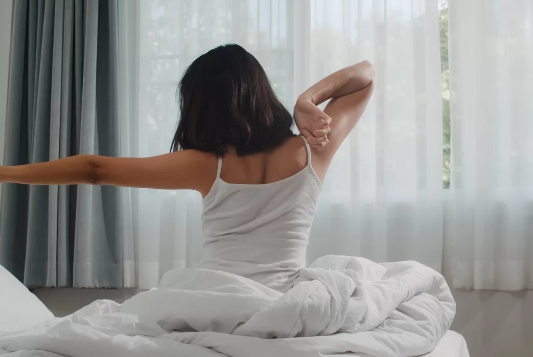 woman waking up from their sleep