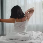 woman waking up from their sleep