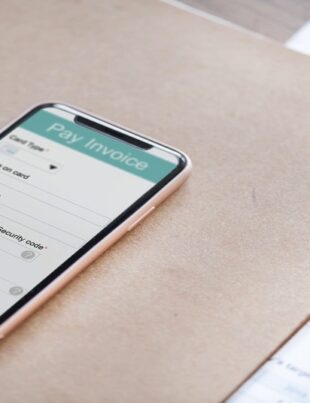 A user’s mobile device displaying e-invoicing system implementation in Malaysia.