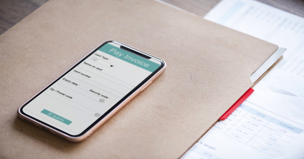 A user’s mobile device displaying e-invoicing system implementation in Malaysia.
