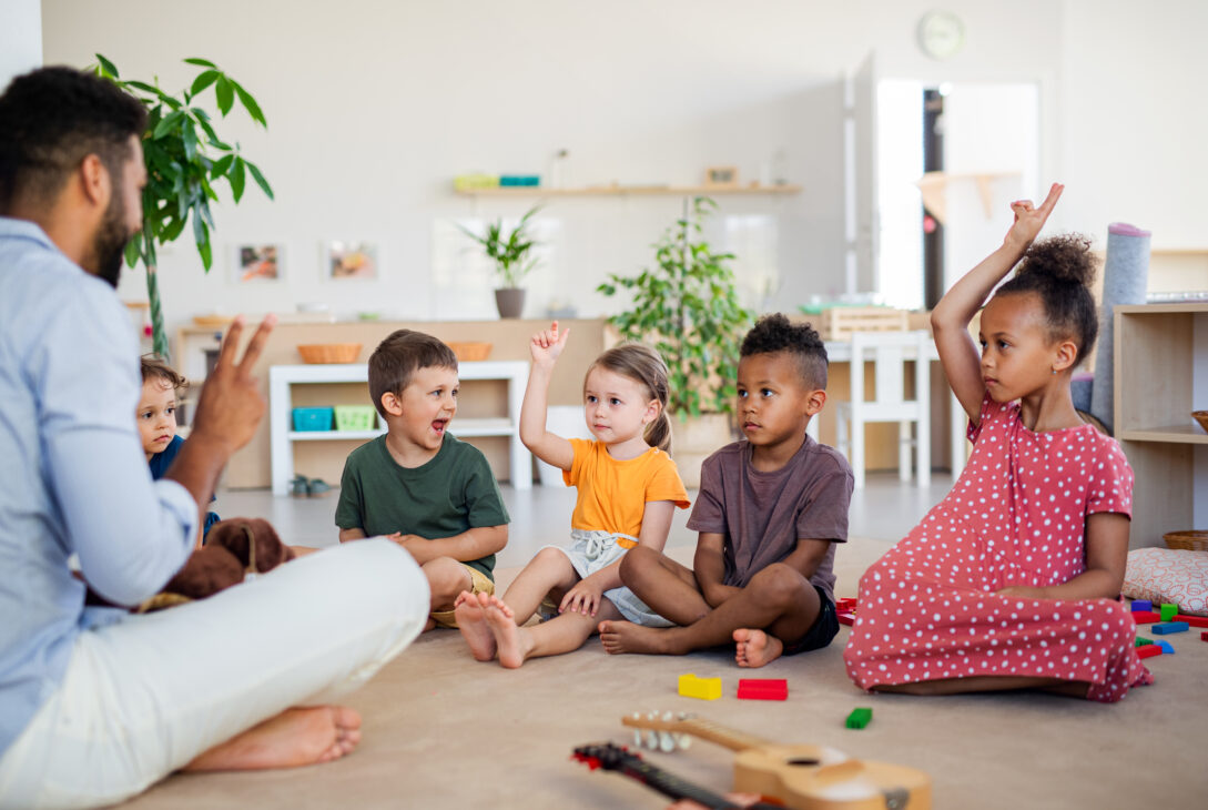 The children is sitting and enjoying learning