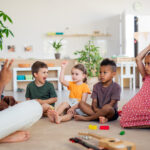 The children is sitting and enjoying learning