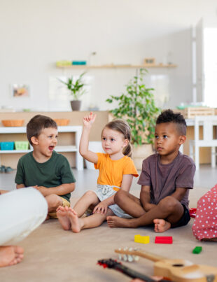 The children is sitting and enjoying learning