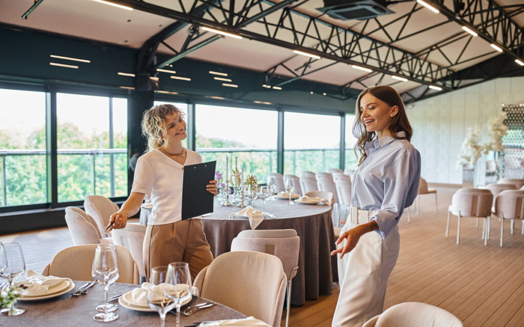 Women listening attentively as a manager explains features of the top event space in Subang Jaya.