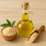 Glass bottle of extra virgin sesame oil with sesame seeds in a wooden bowl and scoop, showcasing sesame oil nutritional benefits