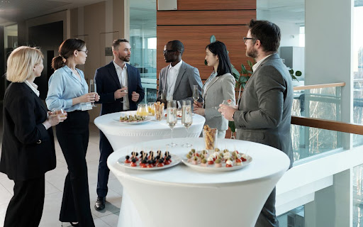 Guests mingling over refreshments at a corporate event held at an event space in Subang Jaya.