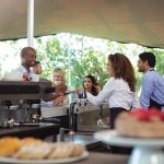 Catering staff serving meals to guests at a corporate event space in Subang Jaya.