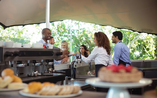 Catering staff serving meals to guests at a corporate event space in Subang Jaya.