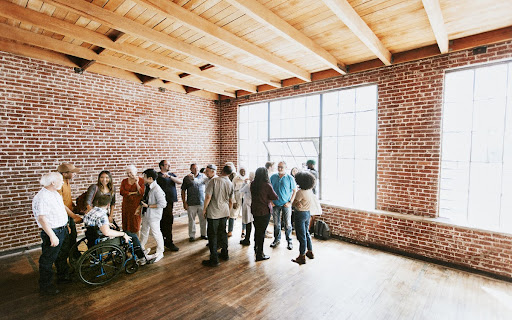 A group of people crowded in the top event space in Subang Jaya