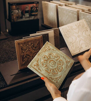 Various decorative wall and floor tiles on display in Selangor showroom, showcasing options and price from a building material supplier in Malaysia.