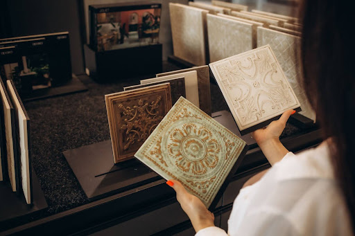 Various decorative wall and floor tiles on display in Selangor showroom, showcasing options and price from a building material supplier in Malaysia.