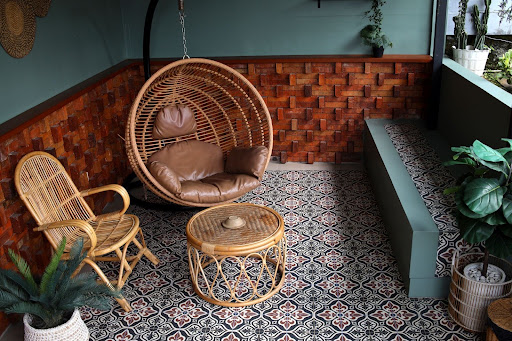 Stylish patio with patterned floor tiles and wooden wall panels, reflecting modern design trends and wall and floor tiles price in Malaysia