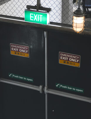 Fire rated emergency exit door with push bar in a commercial building, supplied by a fire rated door supplier in Malaysia. Available from a trusted building material supplier in Selangor.
