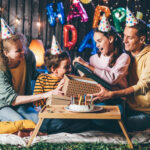 Family celebrating an indoor birthday party with an exciting escape room birthday party for 10 year olds and adults.