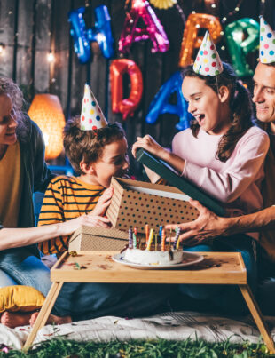 Family celebrating an indoor birthday party with an exciting escape room birthday party for 10 year olds and adults.