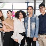 A diverse team of young professionals in Singapore promoting workplace mental health and employee wellbeing