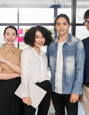 A diverse team of young professionals in Singapore promoting workplace mental health and employee wellbeing