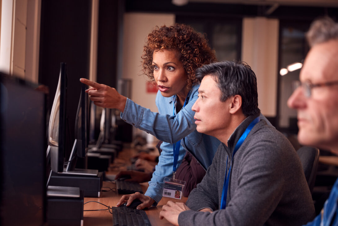 A woman teaches diploma computer systems and networking
