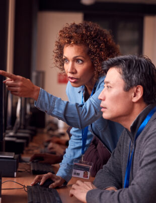 A woman teaches diploma computer systems and networking
