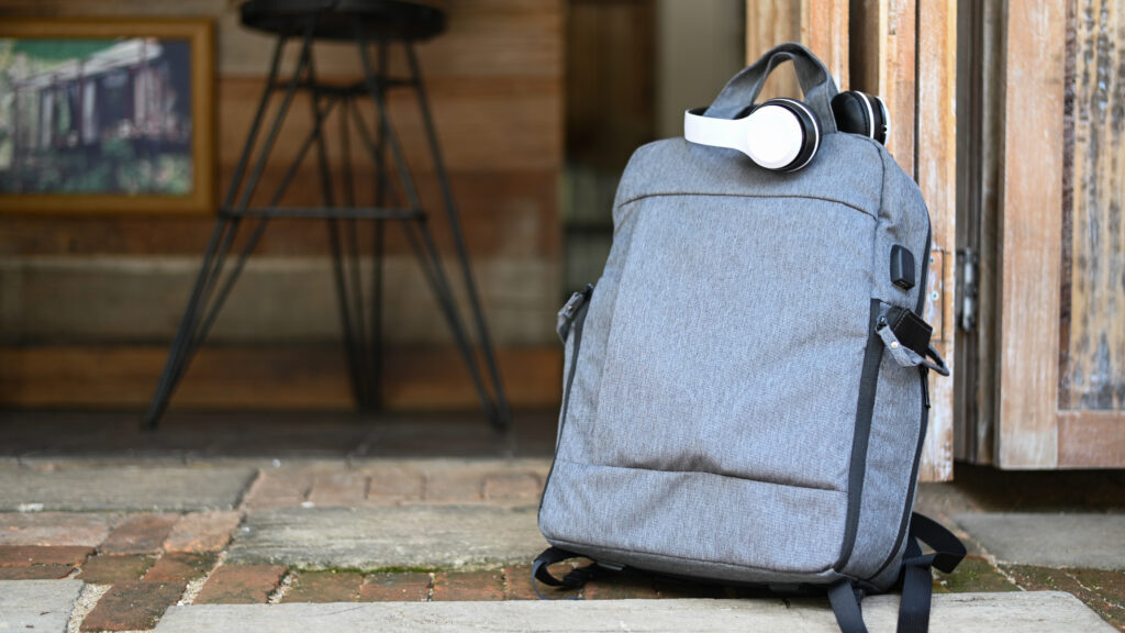 custom made laptop backbag in light blue placed on street