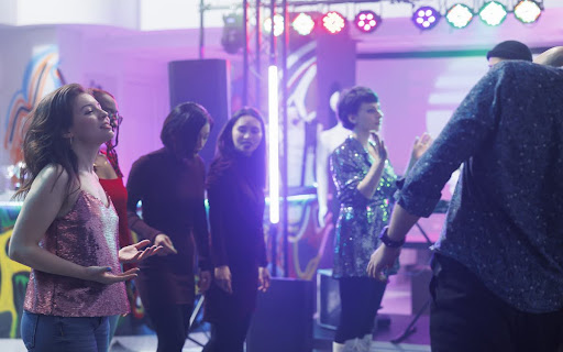 People dancing and having fun during a special occasion at the top event space in Subang Jaya.